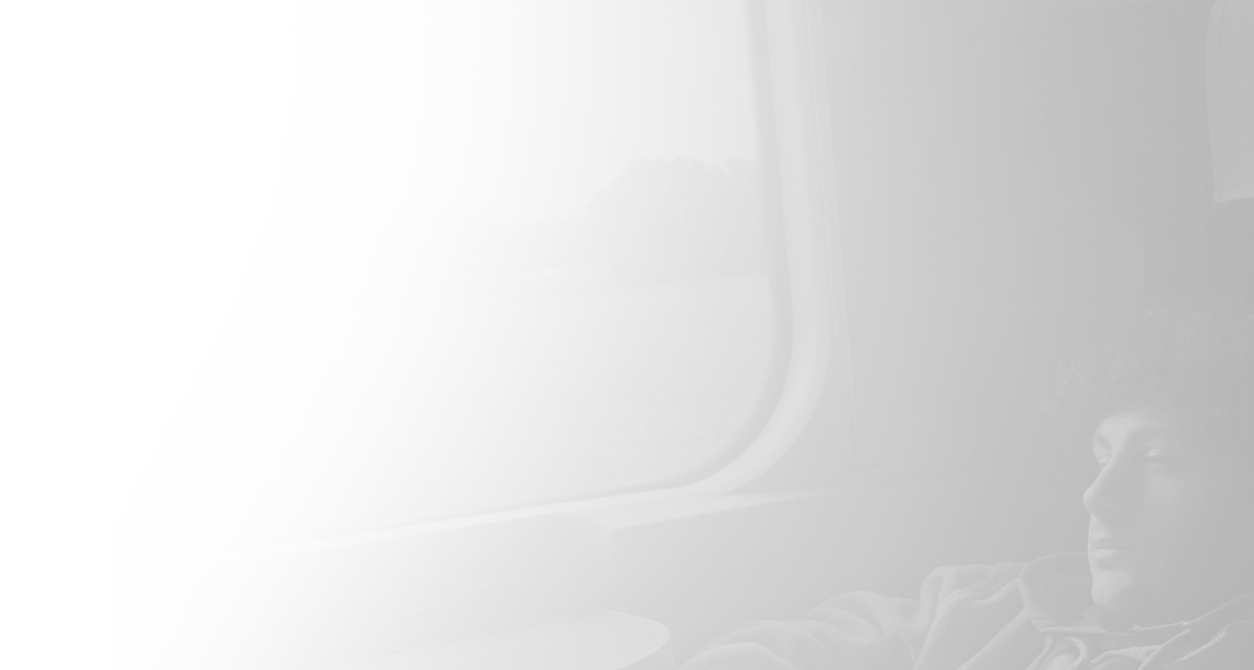 Mehmet Güdük watches out the window while traveling by train.